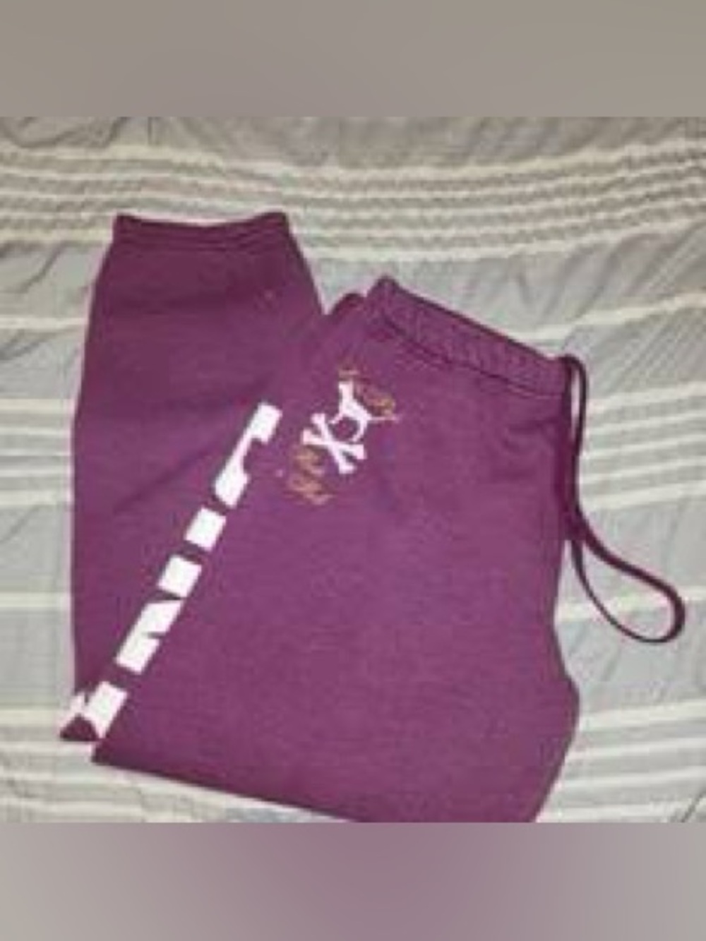 maroon Victoria's Secret PINK sweatpants with bold vertical white logo lettering